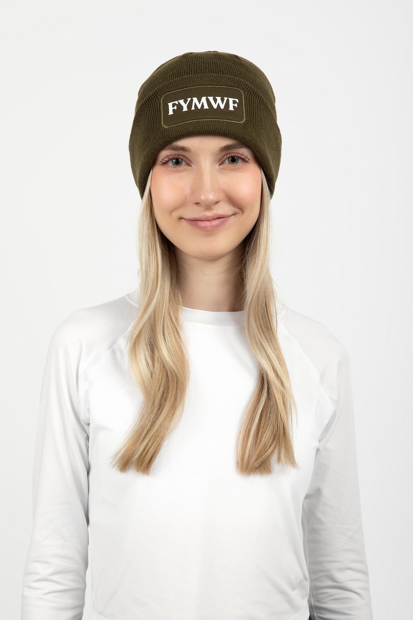 Woman wearing olive green beanie with FYMWF logo