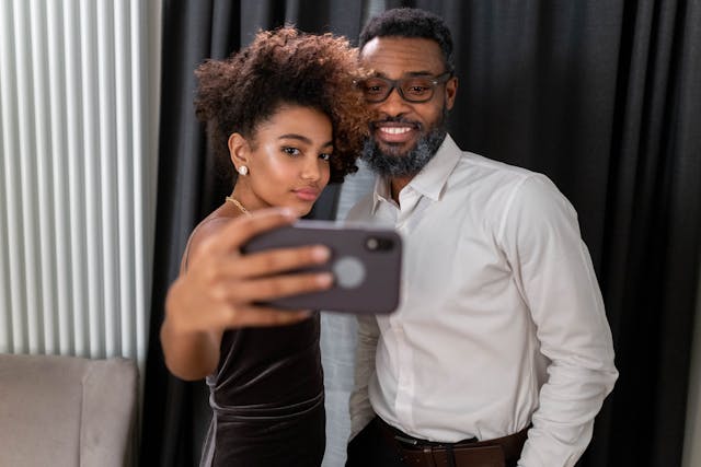 Dad and daughter taking selfie