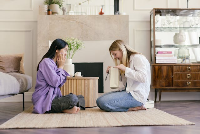Two women exchanging presents