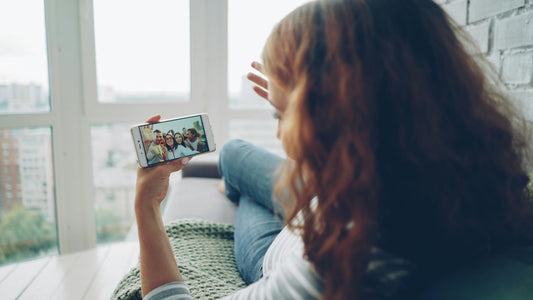 Woman having a video chat with friends on phone