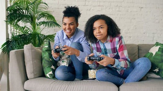 Mom playing video game with teen daughter