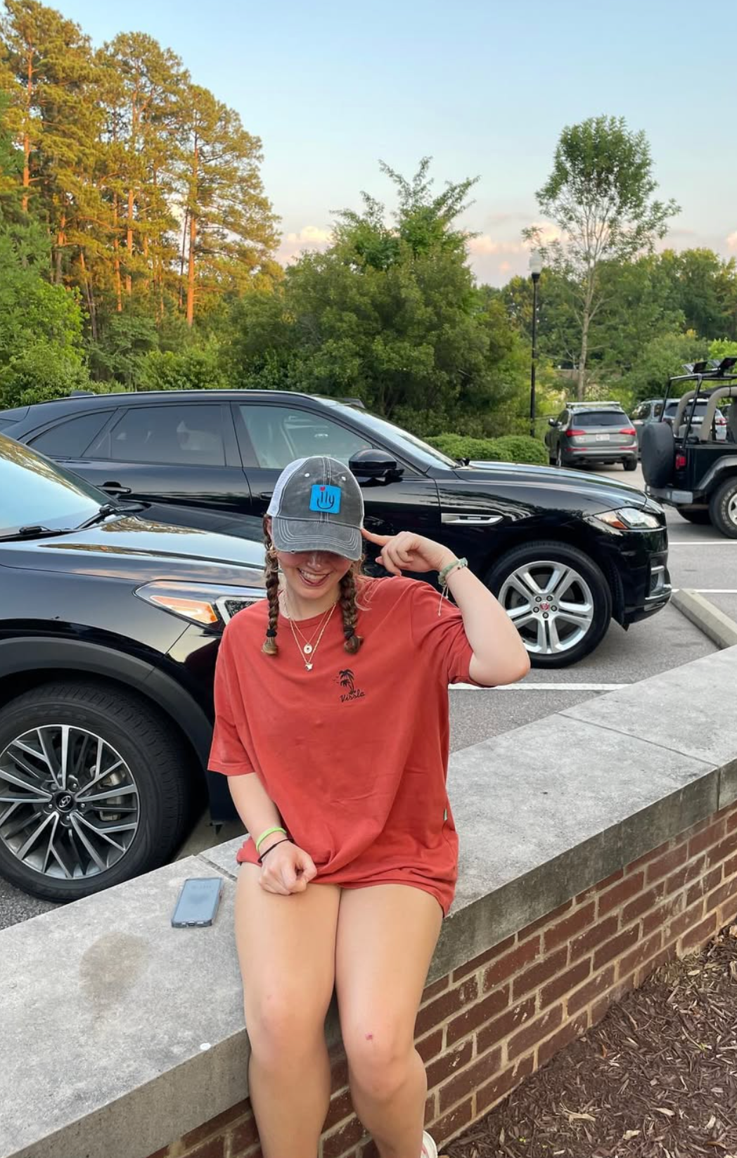 Girl wearing an ILY Baseball Cap with Blue patch