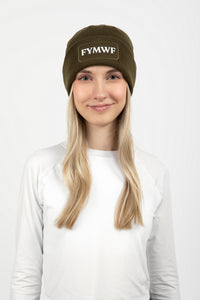 Woman wearing olive green beanie with FYMWF logo