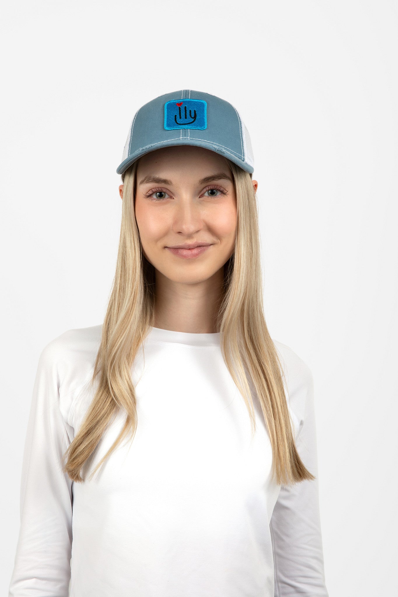 Woman wearing light blue ILY baseball cap with light blue logo - front view