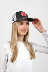 Woman wearing dark gray ILY baseball cap with pink patch - side