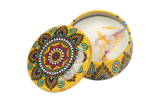 Yellow decorative candle tin that includes dried flowers in the soy wax